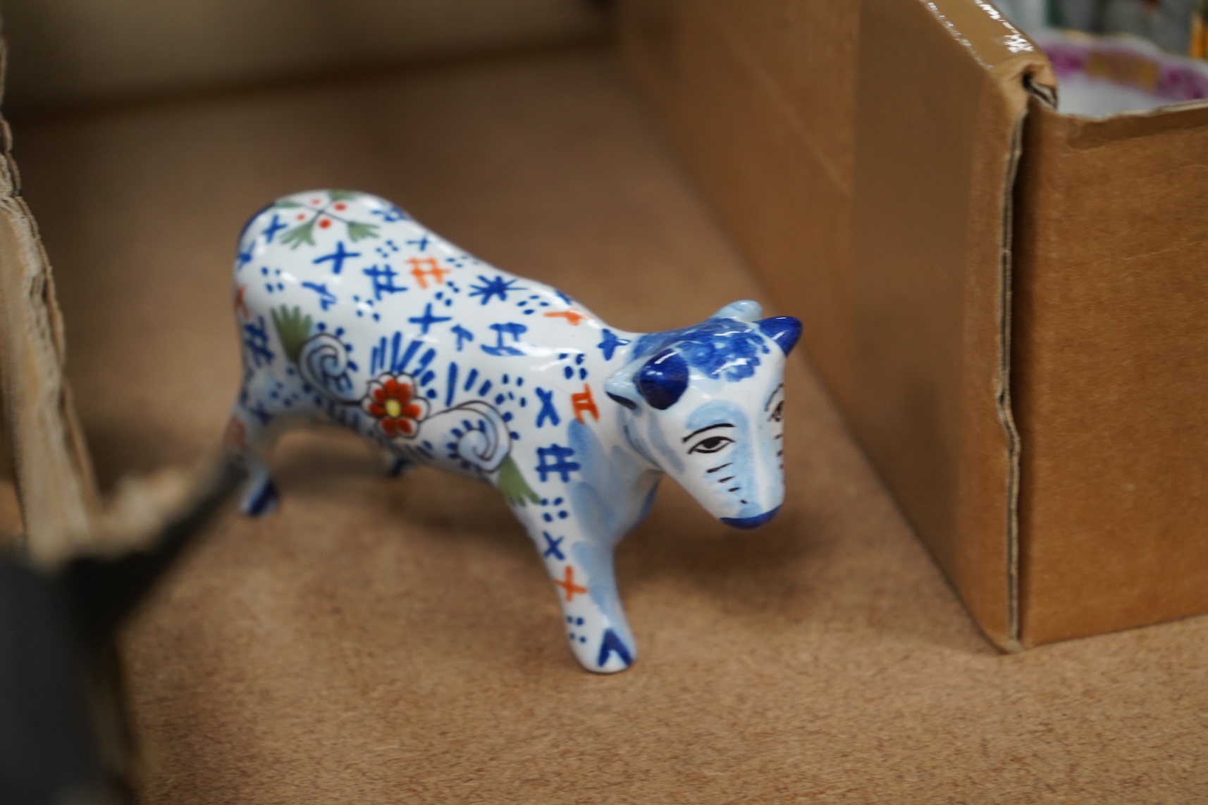 A collection of early 20th century French faience glazed animals, mostly cattle, largest 15cm